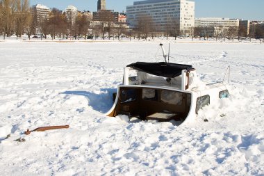 Boat buried in ice