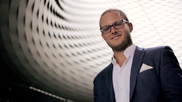 Young happy businessman in glasses and suit — Stock Video