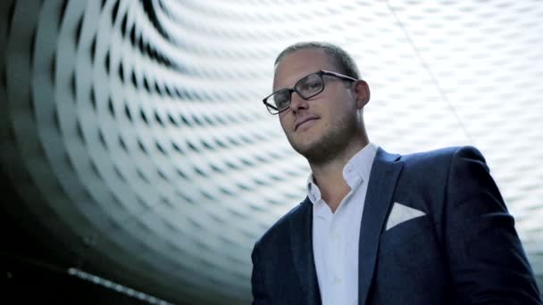 Young happy businessman in glasses and suit — Stock Video