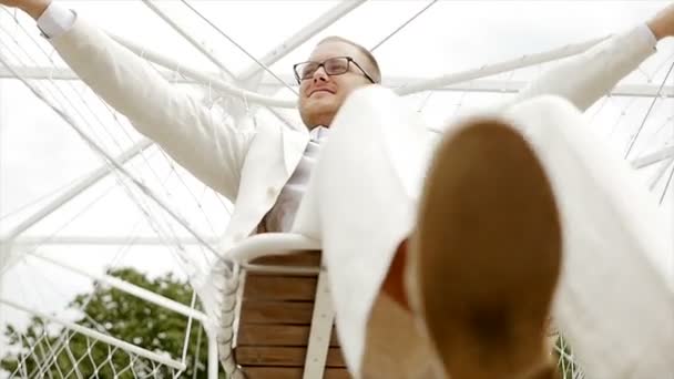 Man sitting in swing — Stock Video