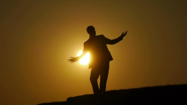 Silhouette of man spinning around — Stock Video