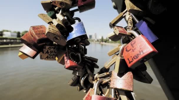 Love locks on bridge — Stock Video