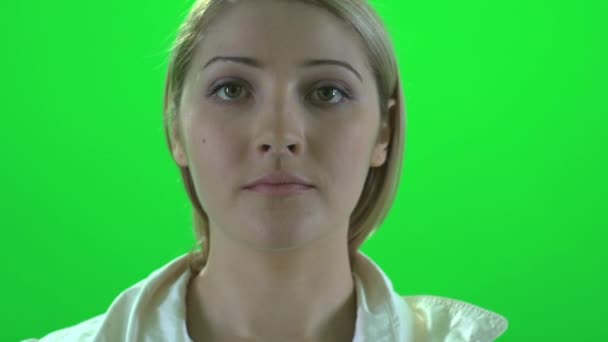 Woman facing camera — Stock Video © stockmedia #69426799