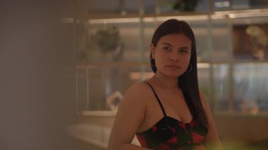 young lady watching through frosted glass, young woman observes through frosted partition