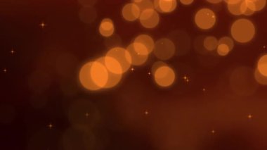 Sıcak kahverengi arka planda kehribar bokeh ışıkları mevsimsel sahneler için samimi sinematik ortam