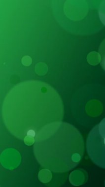 Yüzen Zümrüt Bokeh Işık Çemberleri, Yumuşak Bulanık ve Parlak Yeşil Tonlar Parti Tanıtımı İçin Neşeli Parlak Atmosfer Oluşturdu