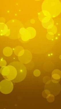 Ilık Altın Bokeh, ışıldayan parçacıklar ve yumuşak partiküllerle ışıltılı bir parti atmosferi.