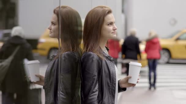 Brunette standing on the sidewalk — Stock Video