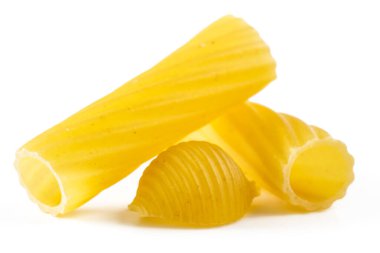 Tubular pasta with swirling wavy surface and shells isolated on white background