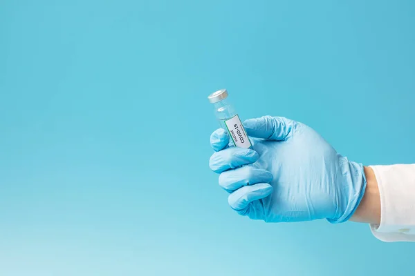 COVID-19 Vaccine vial against Coronavirus infection in hand of doctor with Nitrile Glove in hospital laboratory. Medical, health, Vaccination and immunization concept