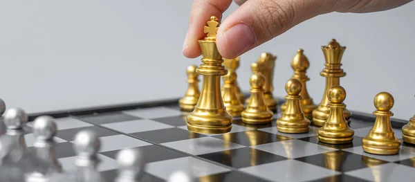 Businessman Hand Moving Gold Chess King Figure Checkmate Opponent Chessboard — Stock Photo, Image