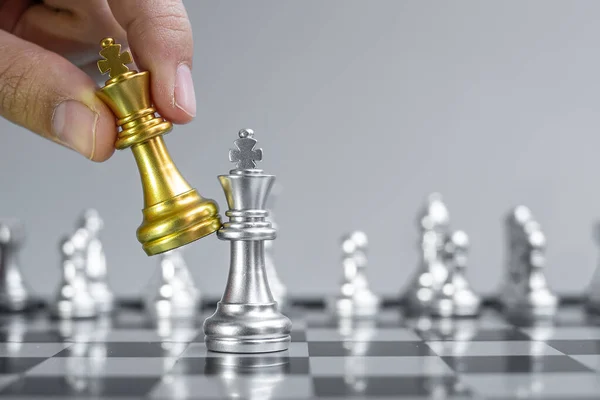 Businessman Hand Moving Gold Chess King Figure Checkmate Opponent Chessboard — Stock Photo, Image