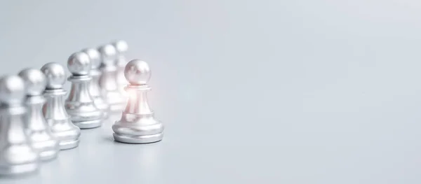 silver chess pawn pieces or leader businessman stand out of crowd people of men. leadership, business, team, teamwork and Human resource management concept