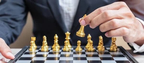 Businessman Hand Moving Gold Chess King Figure Checkmate Opponent Chessboard — Stock Photo, Image