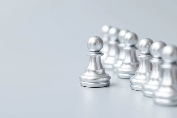 silver chess pawn pieces or leader businessman stand out of crowd people of men. leadership, business, team, teamwork and Human resource management concept