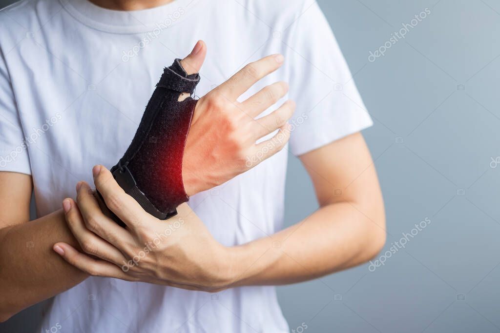 woman holding her wrist pain because using smartphone or computer long time. De Quervain's tenosynovitis, Intersection Symptom, Carpal Tunnel Syndrome or Office syndrome concept