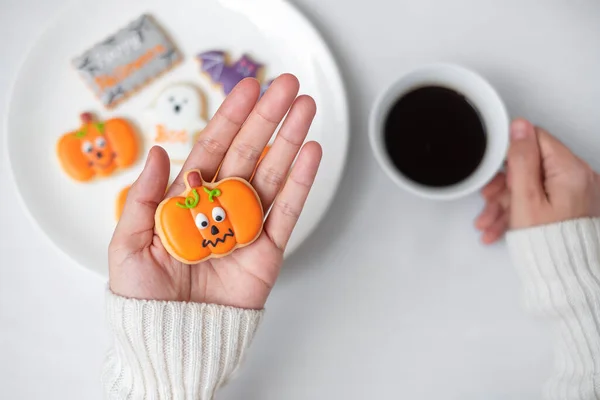 Woman Hand Holding Funny Halloween Cookie Drinking Coffee Happy Halloween — Stock Photo, Image
