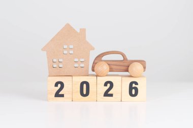 Ev ve araba modeli 2026 yılınız kutlu olsun. gayrimenkul, konut kredisi ve araba kredisi, vergi, yatırım, finans, tasarruf, faiz oranı, ekonomik durgunluk ve yeni yıl kavramları