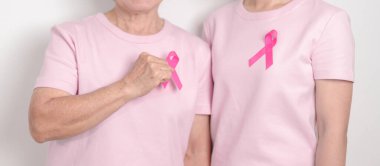 Pembe Ekim Kanser Bilinci ayı için pembe kurdeleli çift, Mayıs Kadın Sağlığı, Kasım Doğum Ebeveynleri Evlat Edinme, Kadın Hakları, Yetkilendirme, Mart Uluslararası Kadınlar Günü ve Kanser Günü