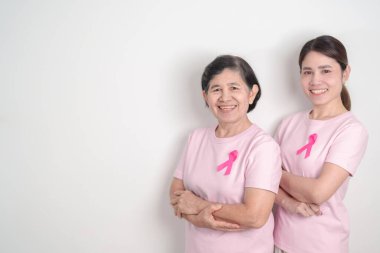 Pembe Ekim Kanser Bilinci ayı için pembe kurdeleli çift, Mayıs Kadın Sağlığı, Kasım Doğum Ebeveynleri Evlat Edinme, Kadın Hakları, Yetkilendirme, Mart Uluslararası Kadınlar Günü ve Kanser Günü