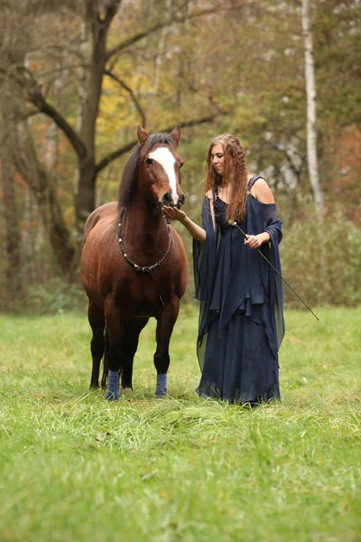 Pretty woman with pony - NHS — Stock Photo, Image