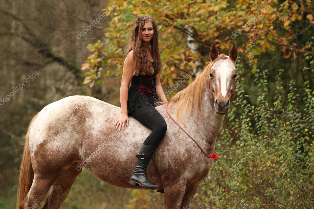 Pretty girl riding a horse without any equipment Stock Photo by ©Zuzule