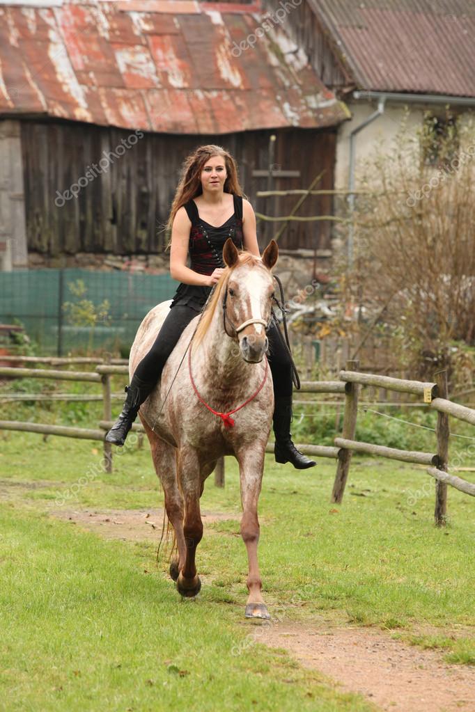 Amazing girl riding a horse without bridle Stock Photo by ©Zuzule 58454277