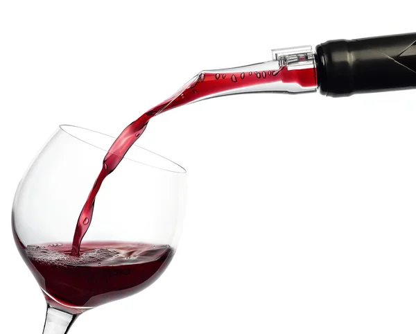 Red wine pouring into a wine glass — Stock Photo, Image