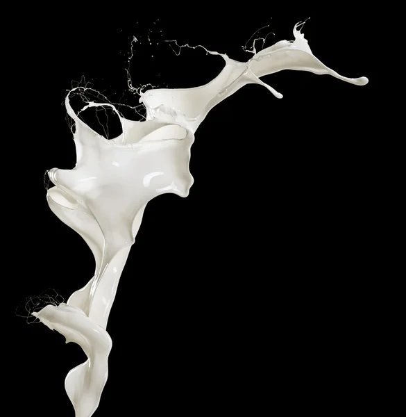 Flying splashing milk isolated on black background — Stock Photo, Image