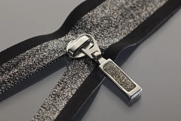 Black zipper decorated with brocade — Stock Photo, Image