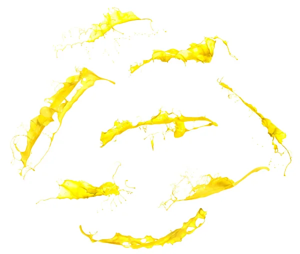Pintura amarilla salpicaduras aisladas sobre fondo blanco — Foto de Stock