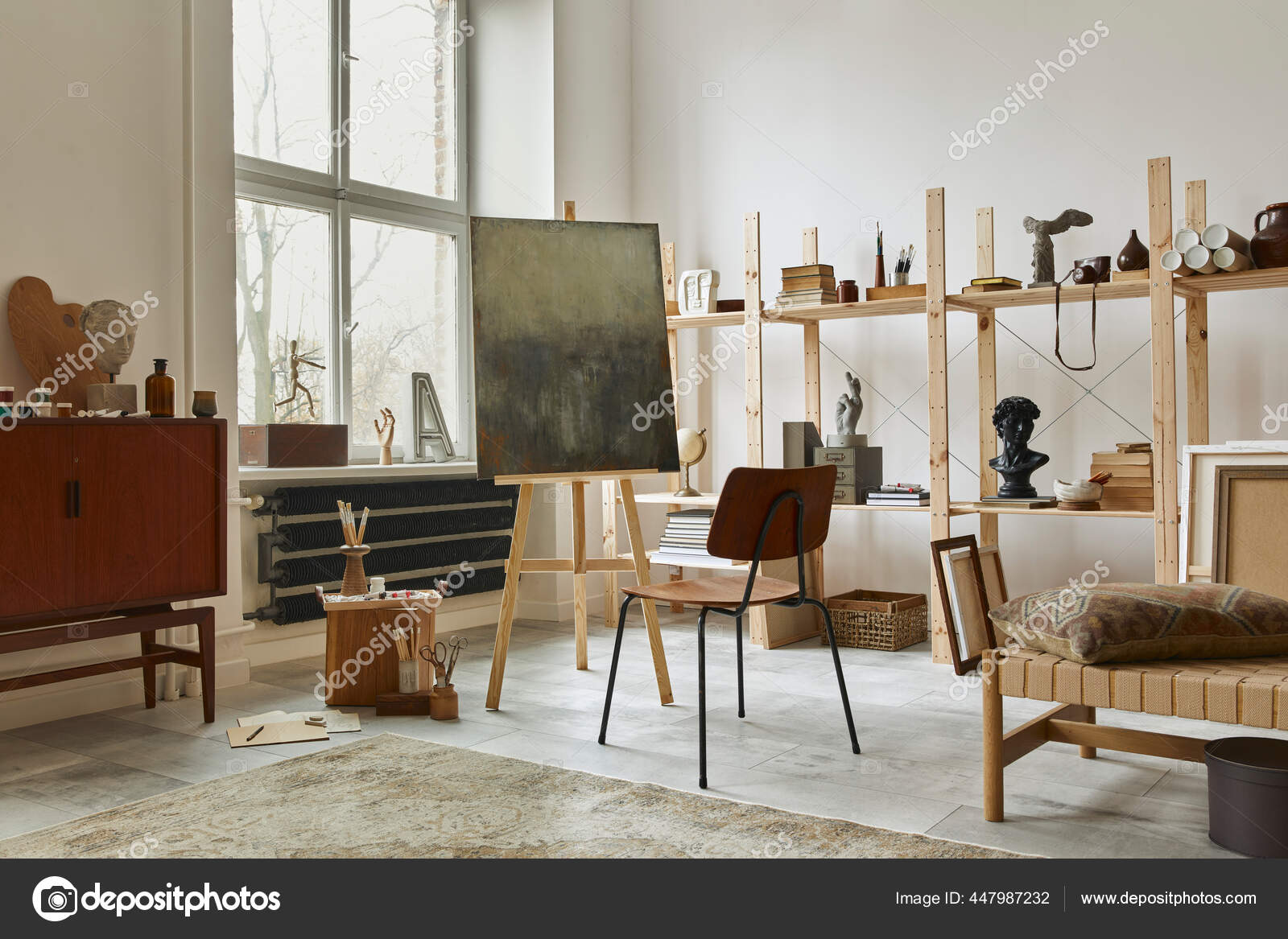 Unique Artist Workspace Interior Stylish Teak Commode Wooden Easel Bookcase Stock by ©Followtheflow 447987232