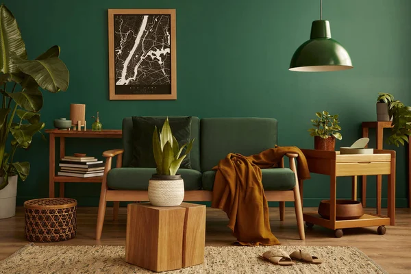 Stylish living room in house with modern retro interior design, velvet sofa, carpet on floor, brown wooden furniture, plants, poster mock up map, book, lamp and perosnal accessories in home decor.