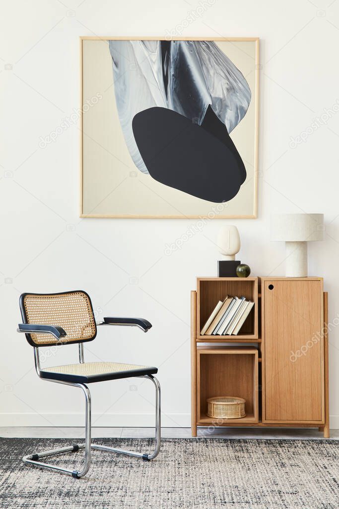 Modern composition of living room interior with design chair, wooden bookcase, table lamp, book, carpet, decoration and mock up abstract painitngs on the wall. Template.
