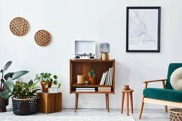 Stylish interior of living room with design wooden shelf, velvet sofa, a lot of plants, mock up poster map, vinyl recorder, book and personal accessories in vintage home decor. Template.