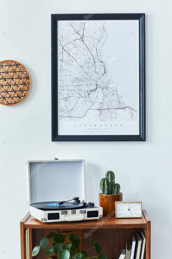 Stylish scandinavian living room interior with retro commode, black mock up poster frame, clock, cacti decoration, book and personal accessoreis in home decor. Template