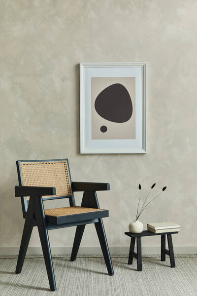 Stylish minimalistic composition of creative living room interior with mock up poster frame, armchair and elegant personal accessories. Neutral wall, carpet on the floor. Template.