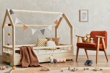 Creative composition of cozy scandinavian child's room interior with wooden bed, plush and wooden toys and textile hanging decorations. Neutral creative wall, carpet on the parquet floor. Template.  clipart