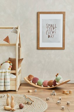 Stylish composition of cozy scandi child's room interior with mock up poster frame, bed, plush caterpillar on balance board, toys and hanging decorations. Creative wall, carpet on the floor. Template. clipart