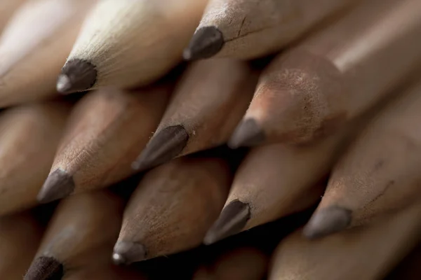 wooden pencils with gray lead for drawing and creativity, close-up pencils made of natural eco-friendly materials safe for work. selective focus