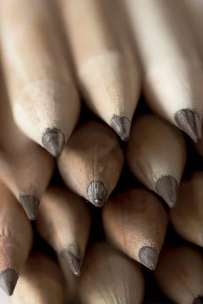 wooden pencils with gray lead for drawing and creativity, close-up pencils made of natural eco-friendly materials safe for work. Selective focus