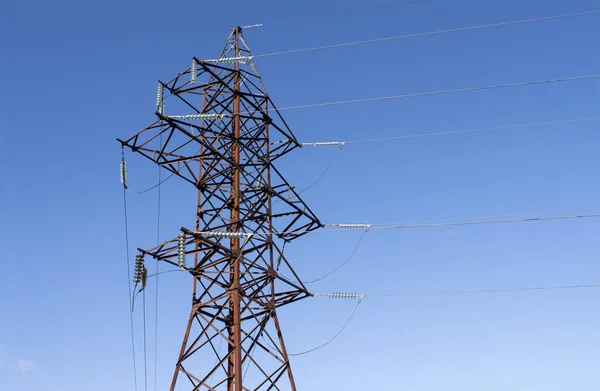 Tower of power line with blue sky background