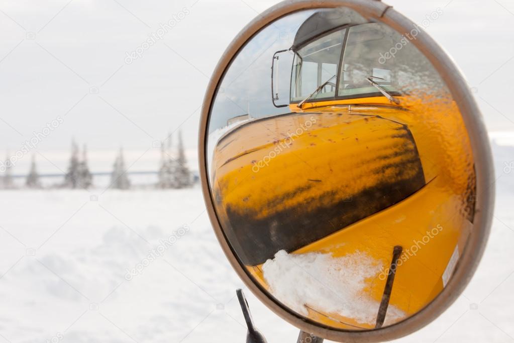 Yellow School Bus Reflected in Side View Mirror