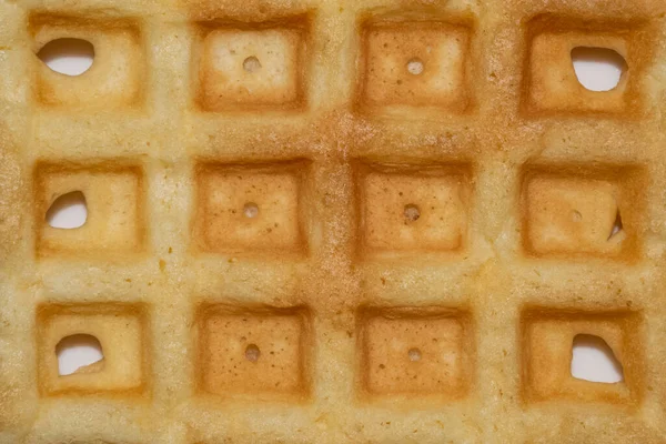 Background of freshly baked belgian waffles with holes — Stock Photo, Image