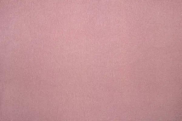 Vzorovaný jemný pastelově růžový bavlněný textil se švy — Stock fotografie
