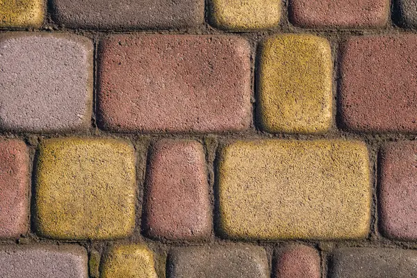 Close up of colourful bright yellow, red and grey outdoor tiles — Stock Photo, Image