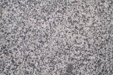 Dokulu açık gri granit yüzey. Makro çekim