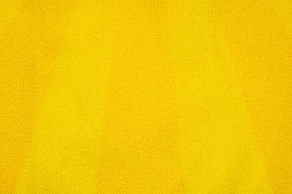 Jasnożółta i pomarańczowa tkanina syntetyczna z pionowymi paskami — Zdjęcie stockowe