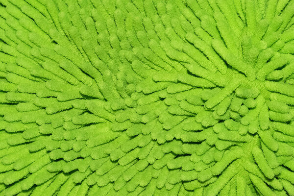 Long hairy light green microfiber towel texture. Close up