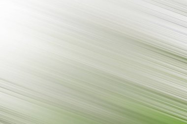 Pastel beyaz ve yeşil köşeli hareket bulanıklığı ve köşede güneş ışığı